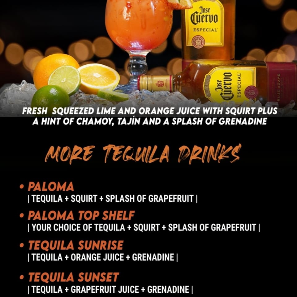 A vibrant orange cocktail with lime and orange slices, Jose Cuervo tequila bottles, and ice.