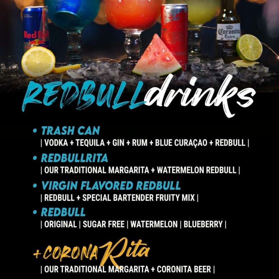 Red Bull drinks menu with cocktails, cans, and fruit garnishes on ice.